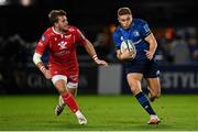 16 October 2021; Jordan Larmour of Leinster in action against Kieran Hardy of Scarlets during the United Rugby Championship match between Leinster and Scarlets at the RDS Arena in Dublin. Photo by Seb Daly/Sportsfile