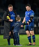 16 October 2021; Tadhg Furlong, left, and Cian Healy of Leinster with Luca Sexton, son of Jonathan Sexton, after the United Rugby Championship match between Leinster and Scarlets at the RDS Arena in Dublin. Photo by Seb Daly/Sportsfile