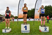 17 October 2021; On the podium after the Junior Women's 4500m race, are, first place Jane Buckley of Leevale AC, Cork, second place Celine Gavin of Dublin City Harriers AC, Dublin, and third place Roisin O'Reilly of Menapians AC, Wexford, during the Autumn Open International Cross Country at the Sport Ireland Campus in Dublin. Photo by Sam Barnes/Sportsfile