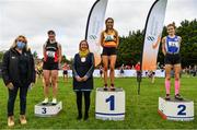 17 October 2021; On the podium after the Junior Women's 4500m race, are, first place Jane Buckley of Leevale AC, Cork, second place Celine Gavin of Dublin City Harriers AC, Dublin, and third place Roisin O'Reilly of Menapians AC, Wexford, with Brid Golden, Deputy President, Athletics Ireland, and Seána Ó Rodaigh, Mayor of Fingal, during the Autumn Open International Cross Country at the Sport Ireland Campus in Dublin. Photo by Sam Barnes/Sportsfile
