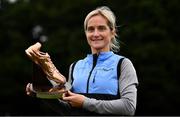 17 October 2021; Annmarie McGlynn of Letterkenny AC, Donegal, with the Jim McNamara Perpetual Trophy after winning the Masters Women's race during the Autumn Open International Cross Country at the Sport Ireland Campus in Dublin. Photo by Sam Barnes/Sportsfile