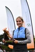 17 October 2021; Annmarie McGlynn of Letterkenny AC, Donegal, with the Jim McNamara Perpetual Trophy after winning the Masters Women's race during the Autumn Open International Cross Country at the Sport Ireland Campus in Dublin. Photo by Sam Barnes/Sportsfile