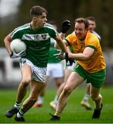 17 October 2021; Jordan Reynolds of Mohill in action against Liam Ferguson of Ballinamore during the Leitrim County Senior Club Football Championship Final match between Mohill and Ballinamore at Páirc Seán Mac Diarmada in Carrick-On-Shannon, Leitrim. Photo by David Fitzgerald/Sportsfile