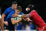 16 October 2021; Garry Ringrose of Leinster is tackled by Blade Thomson of Scarlets during the United Rugby Championship match between Leinster and Scarlets at the RDS Arena in Dublin. Photo by Ramsey Cardy/Sportsfile