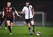 15 October 2021; Michael Duffy of Dundalk and Andy Lyons of Bohemians during the SSE Airtricity League Premier Division match between Bohemians and Dundalk at Dalymount Park in Dublin. Photo by Ben McShane/Sportsfile