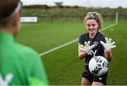 18 October 2021; Leanne Kiernan tries on the goalkeeping gloves of Courtney Brosnan during a Republic of Ireland training session at the FAI National Training Centre in Abbotstown, Dublin. Photo by Stephen McCarthy/Sportsfile