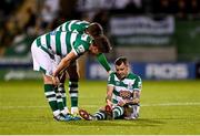 18 October 2021; Sean Kavanagh of Shamrock Rovers is checked on by team-mates Ronan Finn and Sean Gannon during the SSE Airtricity League Premier Division match between Shamrock Rovers and Bohemians at Tallaght Stadium in Dublin. Photo by Seb Daly/Sportsfile