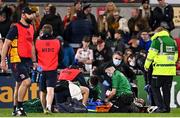 15 October 2021; Will Addison of Ulster is treated for an injury during the United Rugby Championship match between Ulster and Emirates Lions at Kingspan Stadium in Belfast. Photo by Ramsey Cardy/Sportsfile