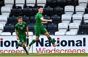 19 October 2021; Adam Queally of Republic of Ireland celebrates after scoring his side's first goal with teammate Leo Healy, right, during the Victory Shield match between Wales and Republic of Ireland at Seaview in Belfast. Photo by Ramsey Cardy/Sportsfile