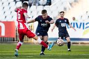 20 October 2021; Thomas Lonergan of St Patrick's Athletic has a shot on goal despite the tackle of Marko Curic of Crvena Zvezda during the UEFA Youth League first round second leg match between Crvena Zvezda and St Patrick’s Athletic at Cukaricki Stadium in Belgrade, Serbia. Photo by Nikola Krstic/Sportsfile