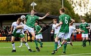22 October 2021; Luke Kehir of Republic of Ireland in action against Joshua Briggs of Northern Ireland during the Victory Shield match between Northern Ireland and Republic of Ireland at Blanchflower Park in Belfast. Photo by Ramsey Cardy/Sportsfile
