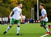 22 October 2021; Cian Mulvilhill of Republic of Ireland celebrates after scoring his side's first goal with team-mate Naz Raji, right, during the Victory Shield match between Northern Ireland and Republic of Ireland at Blanchflower Park in Belfast. Photo by Ramsey Cardy/Sportsfile
