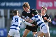 22 October 2021; Patrick Forde of Newbridge College is tackled by Seb Shortt, left, and Hubie McCarthy of Blackrock College during the Bank of Ireland Leinster Schools Junior Cup Final match between Blackrock College and Newbridge College at Energia Park in Dublin. Photo by Piaras Ó Mídheach/Sportsfile