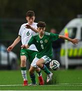22 October 2021; Ryan Donnelly of Northern Ireland in action against Freddie Turley of Republic of Ireland during the Victory Shield match between Northern Ireland and Republic of Ireland at Blanchflower Park in Belfast. Photo by Ramsey Cardy/Sportsfile