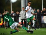 22 October 2021; Trent Kone Doherty of Republic of Ireland is tackled by Joshua Briggs of Northern Ireland during the Victory Shield match between Northern Ireland and Republic of Ireland at Blanchflower Park in Belfast. Photo by Ramsey Cardy/Sportsfile
