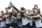 22 October 2021; Newbridge College captain Paddy Taylor celebrates with the cup alongside his team-mates after their side's victory in the Bank of Ireland Leinster Schools Junior Cup Final match between Blackrock College and Newbridge College at Energia Park in Dublin. Photo by Piaras Ó Mídheach/Sportsfile