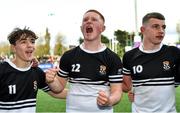 22 October 2021; Newbridge College players, from left, Ardin Magee, Paddy Martin and Paddy Taylor celebrate after their side's victory in the Bank of Ireland Leinster Schools Junior Cup Final match between Blackrock College and Newbridge College at Energia Park in Dublin. Photo by Piaras Ó Mídheach/Sportsfile