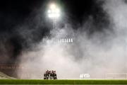 22 October 2021; Bohemians and Waterford players huddle before the Extra.ie FAI Cup Semi-Final match between Bohemians and Waterford at Dalymount Park in Dublin. Photo by Stephen McCarthy/Sportsfile