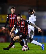 22 October 2021; Rob Cornwall of Bohemians in action against Junior Quitirna of Waterford during the Extra.ie FAI Cup Semi-Final match between Bohemians and Waterford at Dalymount Park in Dublin. Photo by Eóin Noonan/Sportsfile