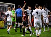 22 October 2021; Kyle Ferguson of Waterford, turned away, is shown a red card by referee Rob Harvey during the Extra.ie FAI Cup Semi-Final match between Bohemians and Waterford at Dalymount Park in Dublin. Photo by Stephen McCarthy/Sportsfile