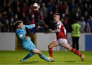 22 October 2021; Darragh Burns of St Patrick's Athletic scores his side's third goal, past Dundalk goalkeeper Peter Cherrie, during the Extra.ie FAI Cup semi-final match between St Patrick's Athletic and Dundalk at Richmond Park in Dublin. Photo by Seb Daly/Sportsfile