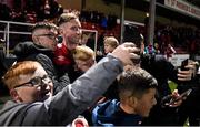 22 October 2021; Ian Bermingham of St Patrick's Athletic takes a photograph with supporters after their side's victory over Dundalk the Extra.ie FAI Cup semi-final match between St Patrick's Athletic and Dundalk at Richmond Park in Dublin. Photo by Seb Daly/Sportsfile