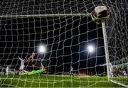 22 October 2021; Georgie Kelly of Bohemians scores his side's goal past Waterford goalkeeper Brian Murphy during the Extra.ie FAI Cup Semi-Final match between Bohemians and Waterford at Dalymount Park in Dublin. Photo by Stephen McCarthy/Sportsfile