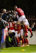 22 October 2021; Matty Smith of St Patrick's Athletic, hidden, celebrates with team-mates and supporters after scoring their side's second goal during the Extra.ie FAI Cup semi-final match between St Patrick's Athletic and Dundalk at Richmond Park in Dublin. Photo by Seb Daly/Sportsfile