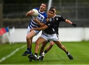 23 October 2021; Brian Kane of Naas is tackled by Danny O'Sullivan of Maynooth during the Kildare County Senior Club Football Championship Semi-Final match between Naas and Maynooth at St Conleth's Park in Newbridge, Kildare. Photo by Harry Murphy/Sportsfile