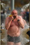 23 October 2021; John Walsh from Howth, Dublin takes a shower after competing in the 101st Jones Engineering Dublin City Liffey Swim which travelled up-river for the first time in the swim’s history. Photo by Ray McManus/Sportsfile