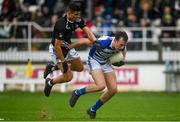 23 October 2021; Paul McDermott of Naas beats the tackle of Danny O'Sullivan of Maynooth on his way to scoring his side's first goal during the Kildare County Senior Club Football Championship Semi-Final match between Naas and Maynooth at St Conleth's Park in Newbridge, Kildare. Photo by Harry Murphy/Sportsfile