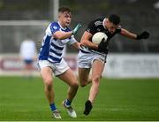 23 October 2021; Ruadhan O'Giollan of Maynooth in action against Tom Browne of Naas during the Kildare County Senior Club Football Championship Semi-Final match between Naas and Maynooth at St Conleth's Park in Newbridge, Kildare. Photo by Harry Murphy/Sportsfile