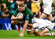 23 October 2021; Niall Murray of Connacht goes over to score his side's first try despite the attempted tackle from Ethan McIlroy of Ulster during the United Rugby Championship match between Connacht and Ulster at Aviva Stadium in Dublin. Photo by David Fitzgerald/Sportsfile