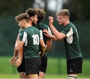 23 October 2021; Chris Poole of Queens University Belfast, second from left, is congratulated after scoring his side's first try during the Maxol Irish Universities Rugby Union Sponsorship Conroy Cup Final at Queens University in Belfast, Antrim. Photo by Oliver McVeigh/Sportsfile
