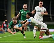 23 October 2021; John Porch of Connacht scores his side's third try despite the efforts of Robert Baloucoune of Ulster during the United Rugby Championship match between Connacht and Ulster at Aviva Stadium in Dublin. Photo by Brendan Moran/Sportsfile