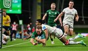 23 October 2021; John Porch of Connacht scores his side's third try despite the efforts of Robert Baloucoune of Ulster during the United Rugby Championship match between Connacht and Ulster at Aviva Stadium in Dublin. Photo by Brendan Moran/Sportsfile