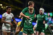 23 October 2021; John Porch of Connacht celebrates with team-mates Conor Fitzgerald and Mack Hansen after scoring their side's third try during the United Rugby Championship match between Connacht and Ulster at Aviva Stadium in Dublin. Photo by Brendan Moran/Sportsfile