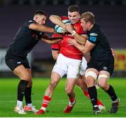 23 October 2021; Shane Daly of Munster is tackled by Owen Watkin and Jac Morgan of Ospreys during the United Rugby Championship match between Ospreys and Munster at Liberty Stadium in Swansea, Wales. Photo by Gruffydd Thomas/Sportsfile