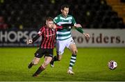 23 October 2021; Aodh Dervin of Longford Town in action against Chris McCann of Shamrock Rovers during the SSE Airtricity League Premier Division match between Longford Town and Shamrock Rovers at Bishopsgate in Longford. Photo by Seb Daly/Sportsfile