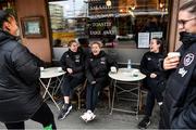 24 October 2021; Republic of Ireland players, from left, Rianna Jarrett, Megan Connolly, Denise O'Sullivan, Roma McLaughlin and Jamie Finn enjoy a coffee at Cafe Tin Tin Tango in Helsinki ahead of the team's FIFA Women's World Cup 2023 Qualifier against Finalnd on Tuesday. Photo by Stephen McCarthy/Sportsfile