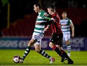 23 October 2021; Chris McCann of Shamrock Rovers in action against Aaron Robinson of Longford Town during the SSE Airtricity League Premier Division match between Longford Town and Shamrock Rovers at Bishopsgate in Longford. Photo by Seb Daly/Sportsfile