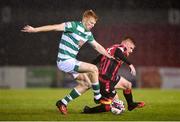 23 October 2021; Rory Gaffney of Shamrock Rovers in action against Aodh Dervin of Longford Town during the SSE Airtricity League Premier Division match between Longford Town and Shamrock Rovers at Bishopsgate in Longford. Photo by Seb Daly/Sportsfile