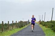 23 October 2021; Parkrun Ireland in partnership with Vhi, added a new parkrun at Achill Greenway on Saturday, 23rd of October, with the introduction of the Achill Greenway parkrun at Achill Greenway, Great Western Greenway in Achill, Mayo. Parkruns take place over a 5km course weekly, are free to enter and are open to all ages and abilities, providing a fun and safe environment to enjoy exercise. To register for a parkrun near you visit www.parkrun.ie. Pictured during the parkrun is winner Ashley Hayes, from Poolbeg in Dublin, running his 100th parkrun. Photo by Brendan Moran/Sportsfile