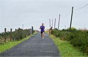 23 October 2021; Parkrun Ireland in partnership with Vhi, added a new parkrun at Achill Greenway on Saturday, 23rd of October, with the introduction of the Achill Greenway parkrun at Achill Greenway, Great Western Greenway in Achill, Mayo. Parkruns take place over a 5km course weekly, are free to enter and are open to all ages and abilities, providing a fun and safe environment to enjoy exercise. To register for a parkrun near you visit www.parkrun.ie. Pictured during the parkrun is winner Ashley Hayes, from Poolbeg in Dublin, running his 100th parkrun. Photo by Brendan Moran/Sportsfile