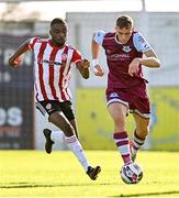 24 October 2021; Killian Phillips of Drogheda United in action against Junior Ogedi-Uzokwe of Derry City during the SSE Airtricity League Premier Division match between Drogheda United and Derry City at United Park in Drogheda, Louth. Photo by Ramsey Cardy/Sportsfile