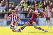 24 October 2021; Joe Thomson of Derry City is tackled by Killian Phillips of Drogheda United during the SSE Airtricity League Premier Division match between Drogheda United and Derry City at United Park in Drogheda, Louth. Photo by Ramsey Cardy/Sportsfile