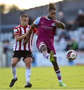 24 October 2021; Jordan Adeyemo of Drogheda United in action against Jack Malone of Derry City during the SSE Airtricity League Premier Division match between Drogheda United and Derry City at United Park in Drogheda, Louth. Photo by Ramsey Cardy/Sportsfile