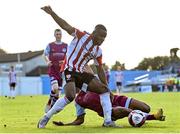 24 October 2021; James Akintunde of Derry City is tackled by Kaleem Simon of Drogheda United during the SSE Airtricity League Premier Division match between Drogheda United and Derry City at United Park in Drogheda, Louth. Photo by Ramsey Cardy/Sportsfile