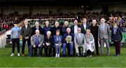 24 October 2021; Representatives of the Limerick team which won the 1921 All-Ireland Senior Hurling Championship, back row, from left, Joe Buckley representing captain Bob McConkey, Young Ireland, Liam O'Mahoney representing Willie Ryan, Cappamore, Pat Murnane representing David Murnane, Fedamore, John Hough representing Willie Hough, Newcastle West, Michael Gleeson representing Willie Gleeson, Fedamore, Gary Howard representing Garrett Howard, Croom, Ken Fitzgibbon representing Tom “Wattles” McGrath, Claughaun, John Keane representing Jack Keane, Castleconnell, Jack Ryan representing Christy Ryan, Pallasgreen, PJ Keane representing Jack Keane, Castleconnell,  Breda Fitzgibbon representing Tom “Wattles” McGrath, Claughaun, front row, from left, Sean Buckley representing captain Bob McConkey, Young Irelands, Eithne Neville representing Mick Neville who played on the Dublin team that day, Enda O'Mahoney representing Willie Ryan, Cappamore, Bob McConkey representing captain Bob McConkey, Young Irelands, Willie Humphries representing Jimmy Humphries, Cappamore, Liz Howard representing Garrett Howard, Croom, pose for a photograph before the Limerick County Senior Club Hurling Championship Final match between Kilmallock and Patrickswell at TUS Gaelic Grounds in Limerick. Photo by Piaras Ó Mídheach/Sportsfile