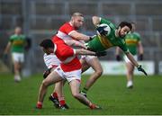 24 October 2021; John Kelly of Tourlestrane in action against Barry O'Mahony, left, and Aaron O'Boyle of Coolera Strandhill during the Sligo County Senior Club Football Championship Final match between Tourlestrane and Coolera Strandhill at Markievicz Park in Sligo. Photo by David Fitzgerald/Sportsfile